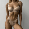 a woman wearing champagne colored lingerie set